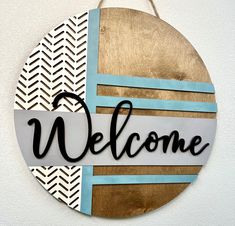 a welcome sign hanging on the wall