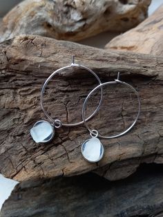 Hand-selected and carefully-matched white sea glass earrings set on a silver coloured 10mm base and held on a silver-coloured brass hoop.  The beautiful sea glass is collected by me on Cornish beaches and lovingly recycled into unique jewellery. Take a piece of real Cornwall home with you. If you are purchasing this item as a gift and wish to include a message you will need to purchase a gift card that you can find in the Gift Card section. Don't forget to follow Inspire Tides on Instagram or Fa Cornish Beaches, White Sea Glass, Brass Hoop Earrings, Sea Glass Earrings, Brass Hoops, White Sea, Beautiful Sea, Glass Earrings, Jewelry Earrings Hoops