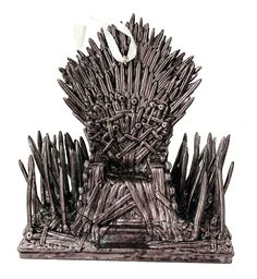 the iron throne statue is made out of wood and has two swords sticking out of it