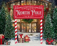 the north pole sign is surrounded by christmas trees