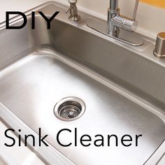 a stainless steel kitchen sink under a faucet