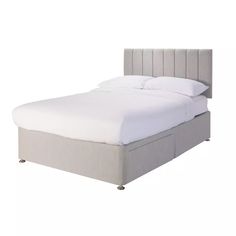 a bed with white sheets and pillows on top of it's headboard, in front of a white background