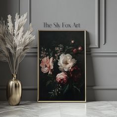 a vase with some flowers in it next to a painting on the wall that says the sky fox