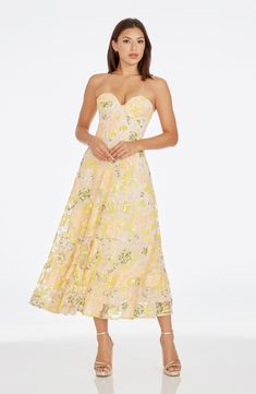 Sequined floral appliqués dazzle and delight on a gauzy strapless midi dress fashioned with a structured bodice. 40" center front length (size Medium) Hidden back-zip closure Sweetheart neck Strapless Lined 100% polyester Hand wash, dry flat Imported Milla Dress, Flower Embroidered Dress, Corset Midi Dress, Shop Dress, Yellow Midi Dress, Garden Dress, Sequin Appliques, Strapless Midi Dress, Dress The Population