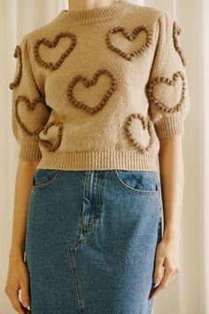 Slip on the Callie Heart Sweater for a classy upgrade to your wardrobe. It features round neckline, puffy sleeves, and heart pompom details up front. It also has a ribbed neckline, cuffs, and hem. Whether you pair it with your favorite jeans or a chic skirt, this gorgeous sweater adds a sweet touch to every ensemble. Selected Color: BEIGE/MULTI . . Fabric Details: 38% ACRYLIC 44% NYLON 18% WOOL Heart Pompom, Knit Heart, Chic Skirt, Chic Skirts, Heart Sweater, Puffy Sleeves, Ribbed Neckline, Fabric Details, Favorite Jeans