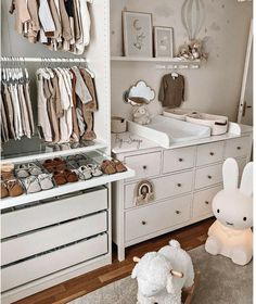 a baby's room with lots of closet space and toys on the floor next to it