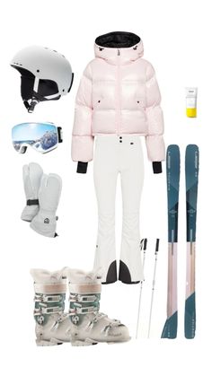 a woman in pink jacket and white snowsuit next to ski equipment