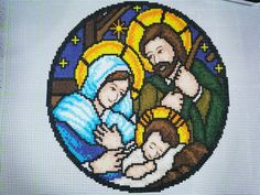 a cross stitch nativity scene with the birth of jesus and baby jesus on it