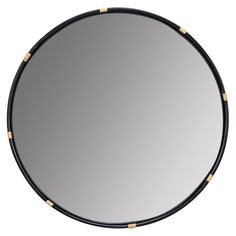 a round mirror with gold studs on the edges and black frame, against a white background