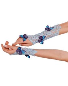 two women's hands with blue flowers on them