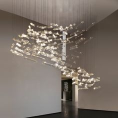 an abstract sculpture is suspended from the ceiling