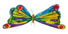 the colorful butterfly is flying in the air with its wings spread out and eyes open