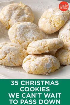 a white plate topped with cookies covered in powdered sugar next to a green sign that says, 35 christmas cookies we can't wait to pass down