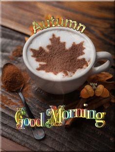 there is a cup of coffee with cinnamon in it and an autumn leaf on top