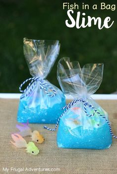 two bags filled with blue soap sitting on top of a table next to each other