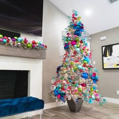 a brightly colored christmas tree in a living room