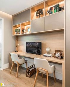 a room with two chairs and a desk in front of a sliding glass door that leads to a balcony