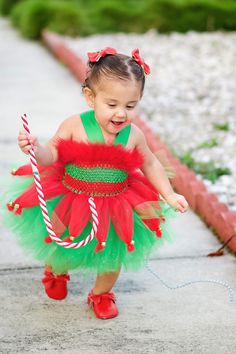 Please leave your event date in the notes to seller. Our current turn around time is 2 weeks for holiday orders The ELF tutu dress is an absolute must have for every little princess. It is perfect for the holiday, holiday photos or just to wear on Christmas! The dress is made out of a crochet top covered with a red marabou trim at the top and green halter straps that criss cross in the back and tie in a bow. The skirt is layered with green on the bottom and red in the top. The red tulle is gathe Feather Tutu, Toy Story Halloween, Elf Dress, Toy Story Costumes, Sweet Pictures, Photography Christmas, Harry Potter Halloween, Elf Clothes, Sweet Pic