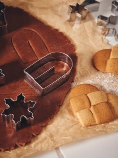 some cookies and cookie cutters on a table