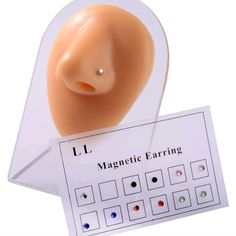 an image of a fake head on top of a plastic sheet with magnetic earing