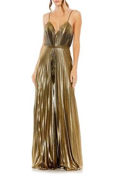 Enter your next special event in a disco-chic manner with this crisp, accordion-pleated jumpsuit styled with flowy wide legs, slender straps and a banded waist. 61" length; 31 1/2" inseam; 136" leg opening (size 8) Plunge neck Spaghetti straps Partially lined 100% polyester Spot clean Imported Asian Owned/Founded Pleated Jumpsuit, Formal Jumpsuit, Mac Duggal, Jumpsuit Fashion, Sleeveless Jumpsuits, Gold Dress, Fashion Fabric, Wide Leg Jumpsuit, Antique Gold