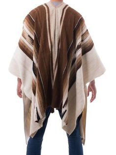 Warm shades of tan, brown and ivory exalt the fertile Andean earth. Working in luxurious alpaca, Faustino Maldonado creates a men's poncho with pre-Hispanic motifs. The warm but lightweight garment is woven on the hand loom. Brown Alpaca Winter Cape, Brown Alpaca Poncho For Winter, Traditional Brown Poncho For Festival, Brown One Size Cape, Brown Long Sleeve One-size Cape, Oversized Brown Cape Shawl, Brown One Size Shawl Wrap, Brown One-size Shawl Wrap, Brown Shawl Wrap One Size