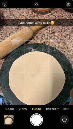 an image of some food being made on a plate with a rolling pin next to it