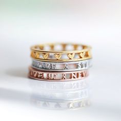 This gorgeous custom ring is an adorable way to keep your loved ones with you wherever you go. There is a heart between each name. - you can choose any symbols you would like (hearts, animals, signs, zodiac etc etc) You can choose up to 3-5 names/words (10 characters each max - if you need more characters per name please let me know so we can accommodate). You can do more than 3 -5 names/words for an additional charge. No more than 5 names/words can fit on one ring depending on how many letters Ring With Name, Gold Sterling Silver Rings With Names, Affordable Silver Rings With Custom Name, Custom Name Silver Rings, Personalized Name Ring Jewelry, Custom Name 14k Gold Rings For Personalized Gift, Name Rings, One Ring, Caicos Islands