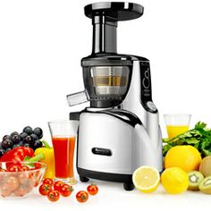 a silver and black juicer surrounded by fruits and vegetables