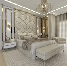 a bedroom with a large bed and chandelier