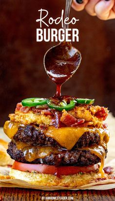 A rodeo burger piled high with fixings.  A spoon is drizzling on the BBQ sauce. Bbq Sauce For Burgers, Rodeo Burger Recipe, Elevated Burger Recipes, Fancy Burgers Ideas, Burger Ideas Restaurant, Western Burgers Recipes, Smash Burger Ideas, Best Burger Recipes, Creative Burger Ideas