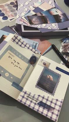 an open scrapbook with pictures and writing on the pages next to a cup of coffee