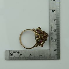 Antique 14K Yellow Gold Ruby Dome Ring, almost rose color gold, .5 inch high, .75 inch across, 4 pear shaped rubies, 12 round rubies, not calibre cut, 3.82 grams, Circa 1940, Size 7. SKU # BB264R25 Most rings are sizable for a small fee. If the ring you are considering is the incorrect size contact us for a quote. This listing contains photographs of the actual item you will receive. Our items are in excellent condition with little or no signs of wear and many are one of a kind pre-owned estate Antique 14k Gold Ruby Ring With Multi-stone, Pear-shaped 14k Gold Ruby Ring, Formal Gold Pear-shaped Ruby Ring, Antique Yellow Gold Multi-stone Ruby Ring, Antique Multi-stone Ruby Ring In Yellow Gold, Vintage Multi-stone Ruby Ring, Gold Ruby Ring Pear-shaped, Gold Multi-stone Pear-shaped Ring, Gold Ruby Ring With Pear-shaped Gemstone