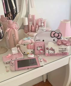 a hello kitty themed vanity with pink accessories