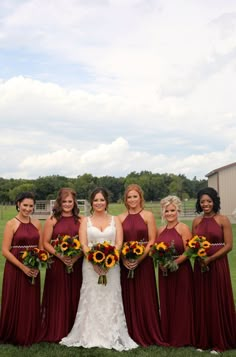 the bride and her bridesmaids pose for a photo