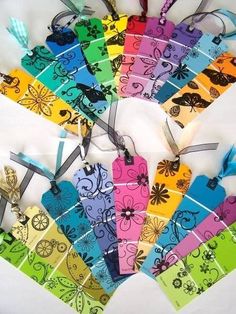 many colorful tags with different designs on them