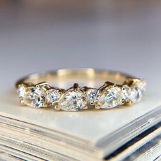 a close up of a wedding ring on top of a book