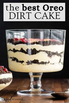 the best oreo dirt cake in a glass dish on a wooden table with text overlay