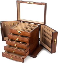 an open wooden jewelry box on a white background