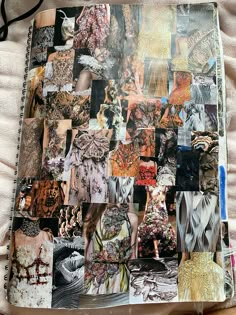 an open notebook covered in many different pictures