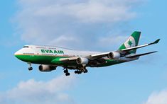 an eva air plane flying in the sky with it's landing gear down and its wheels out