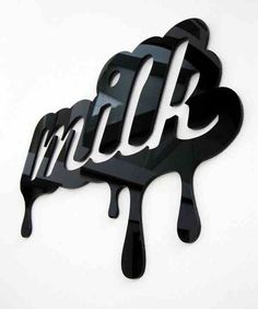 a black and white sign with the word milk dripping from it