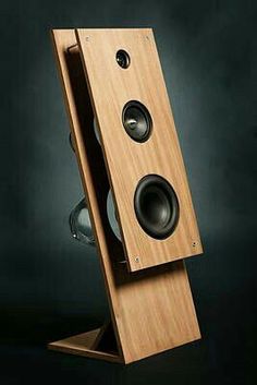 a wooden speaker with two speakers in it