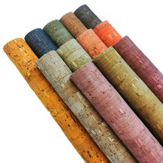 a bunch of different colored corks stacked on top of each other