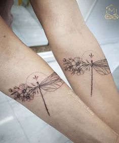 two tattoos on the legs of people with dragonflies and daisies in their arms