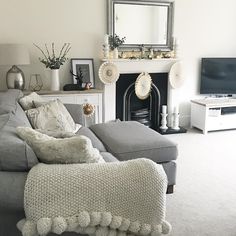 a living room filled with furniture and a fire place