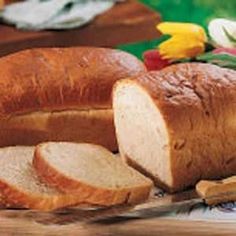 sliced loaf of bread sitting on top of a cutting board