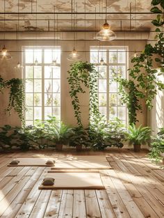 a room with wooden floors and plants growing on the windowsills in front of them