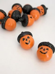 several orange and black pumpkins with faces on them