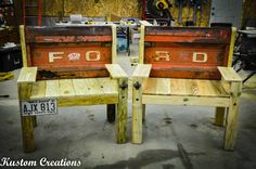 two wooden benches made out of old ford parts sitting in a garage next to each other